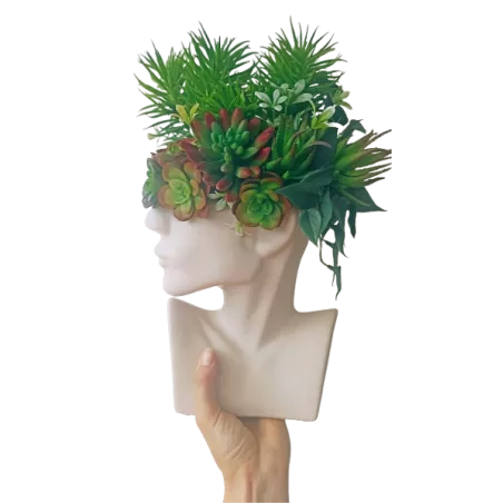 Designerski wazon w kształcie głowy z kompozycją sztucznych sukulentów
